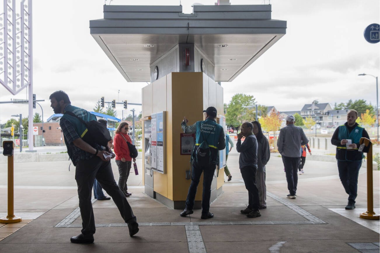 Sound Transit Community Support personnel help riders navigate the new station on Tuesday, Sept. 3, 2024 in Lynnwood, Washington. (Olivia Vanni / The Herald)