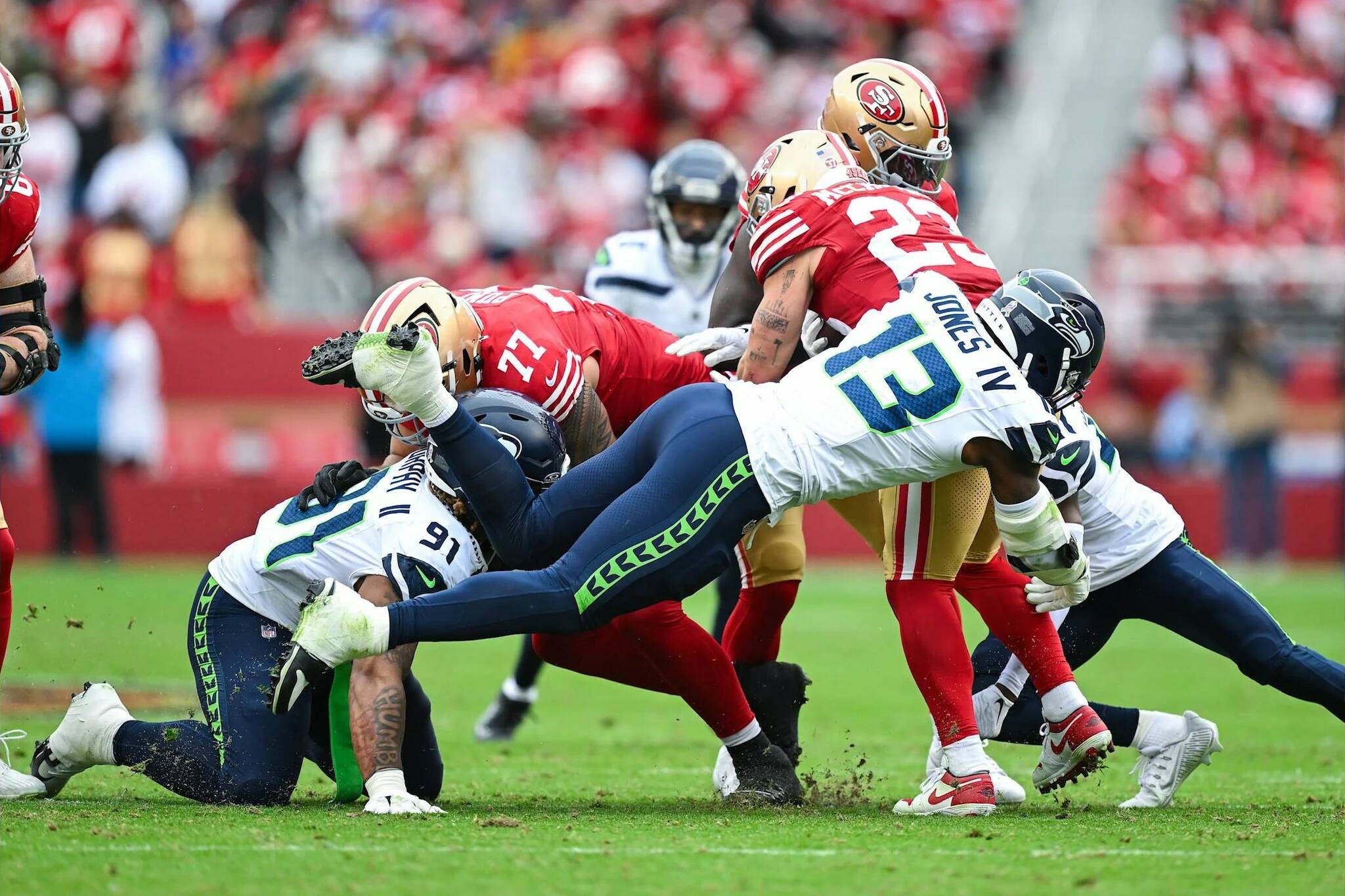 Seahawks linebacker Ernest Jones IV (13) tackles San Francisco running back Christian McCaffery (23) in the Seahawks’ 20-17 victory over the 49ers at Levi’s Stadium on Nov. 17, 2024. (Photo courtesy of the Seattle Seahawks)