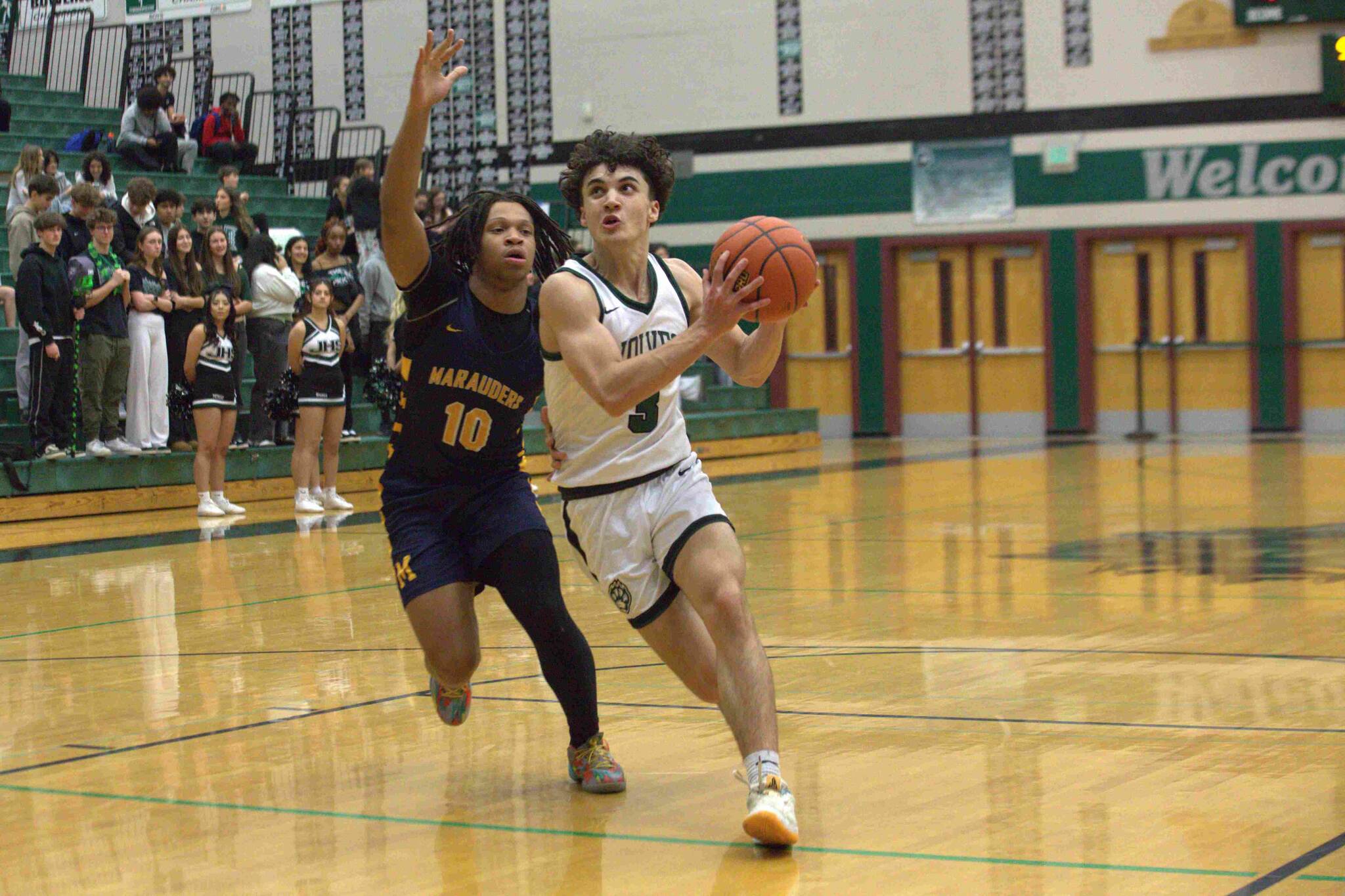 Jackson’s Mason Engen (3) tries to drive past Mariner’s Tobias Alexander (10) in a Wesco 4A game on Friday, Jan. 17 at Jackson High School. (Aaron Coe / The Herald)