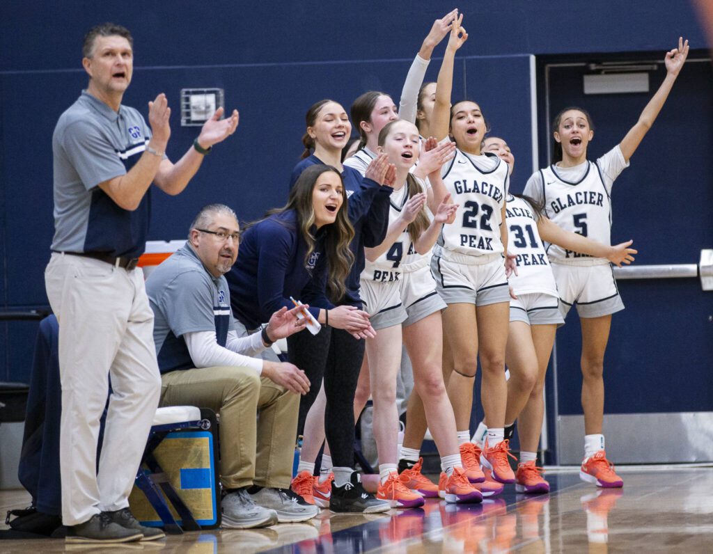 The Glacier Peak bench reacts to a three point shot during the game against Lake Stevens on Friday, Jan. 24, 2025 in Snohomish, Washington. (Olivia Vanni / The Herald)
