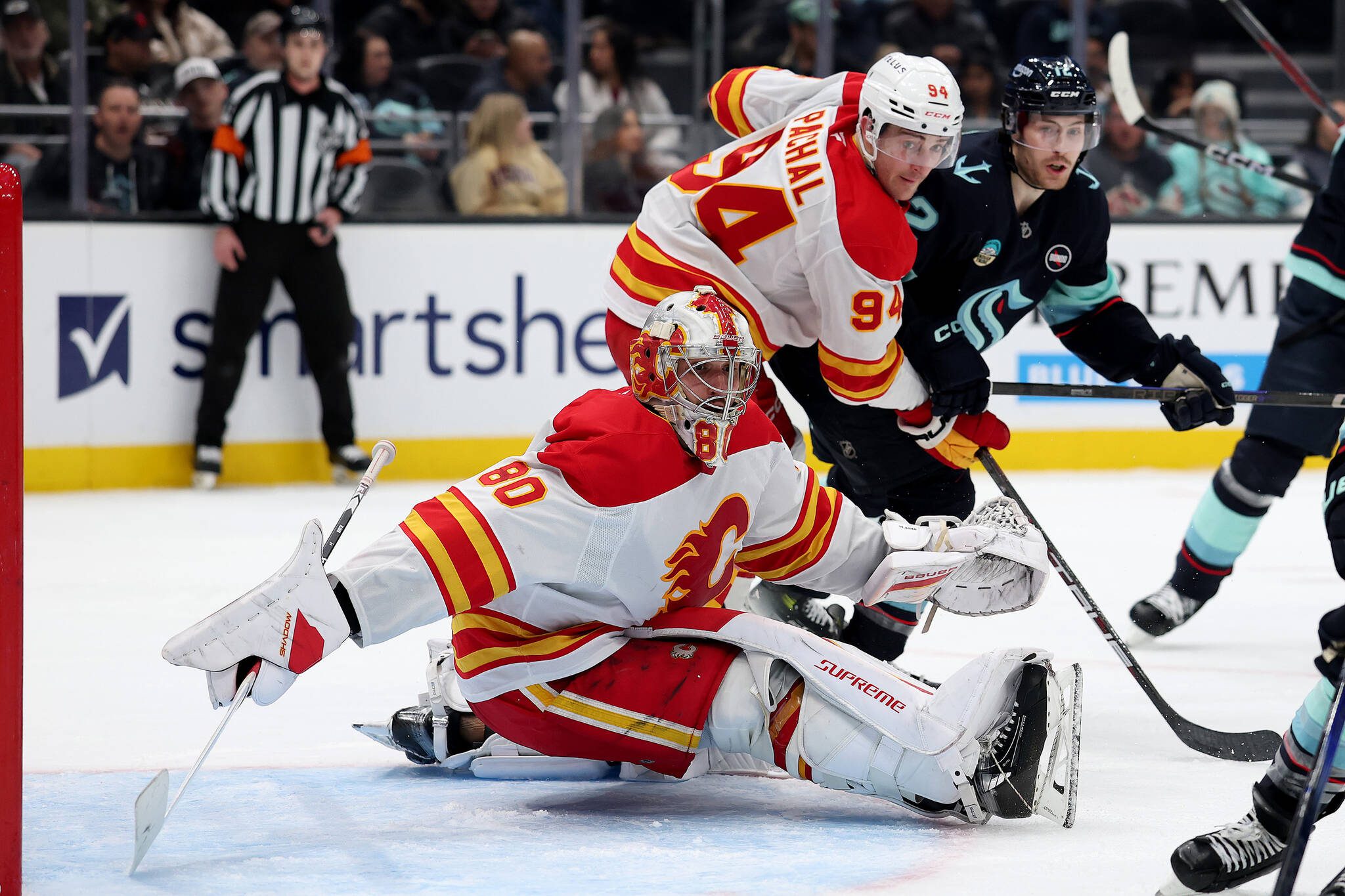 Dan Vladar (80) of the Calgary Flames looks to make a save against the Seattle Kraken during the second period at Climate Pledge Arena on Feb. 2, 2025, in Seattle. (Steph Chambers / Getty Images / Tribune News Services)