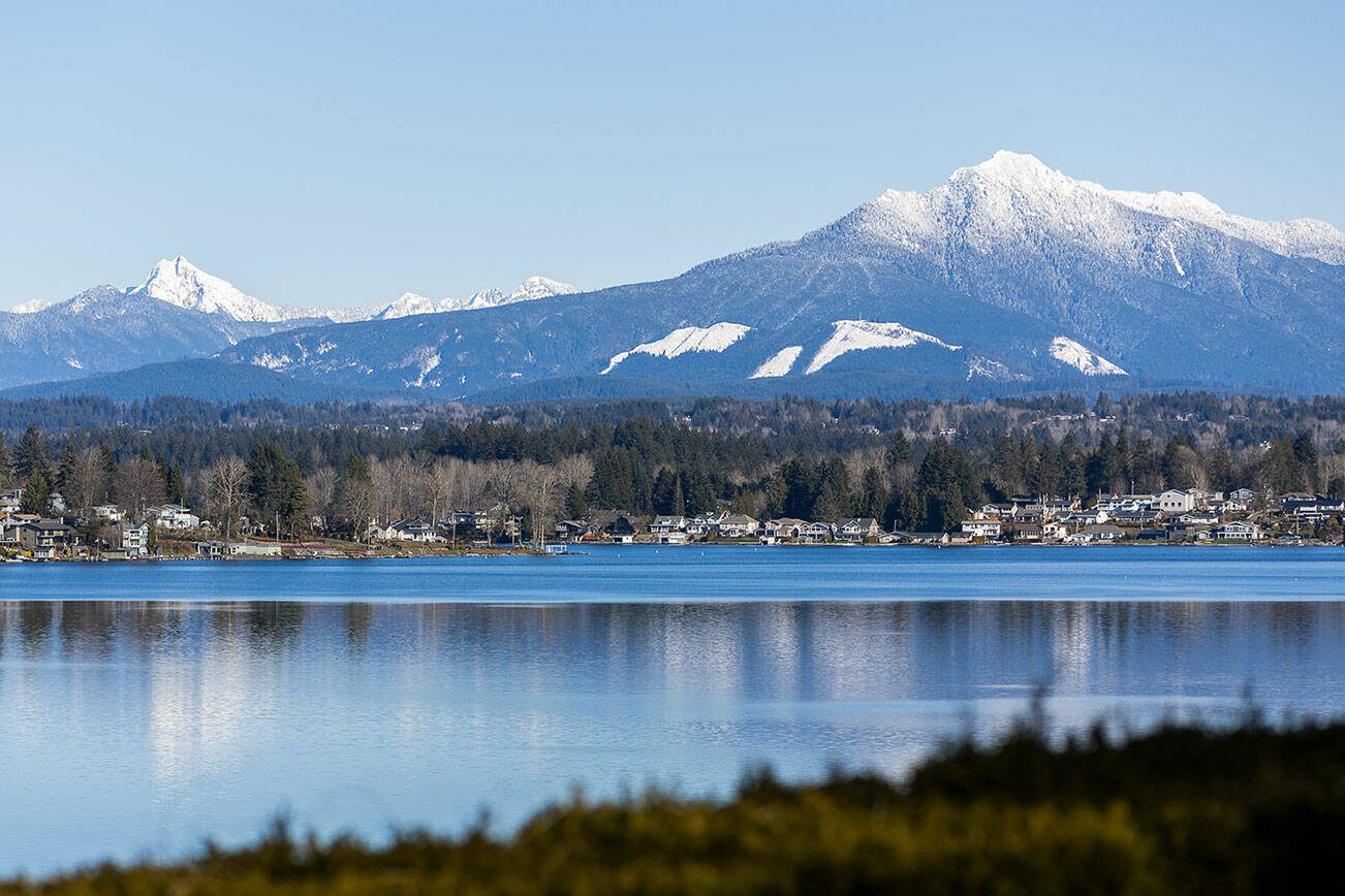 The peaks of Mount Pilchuck, left, and Liberty Mountain, right, are covered in snow on Wednesday, Feb. 12, 2025 in Lake Stevens, Washington. (Olivia Vanni / The Herald)