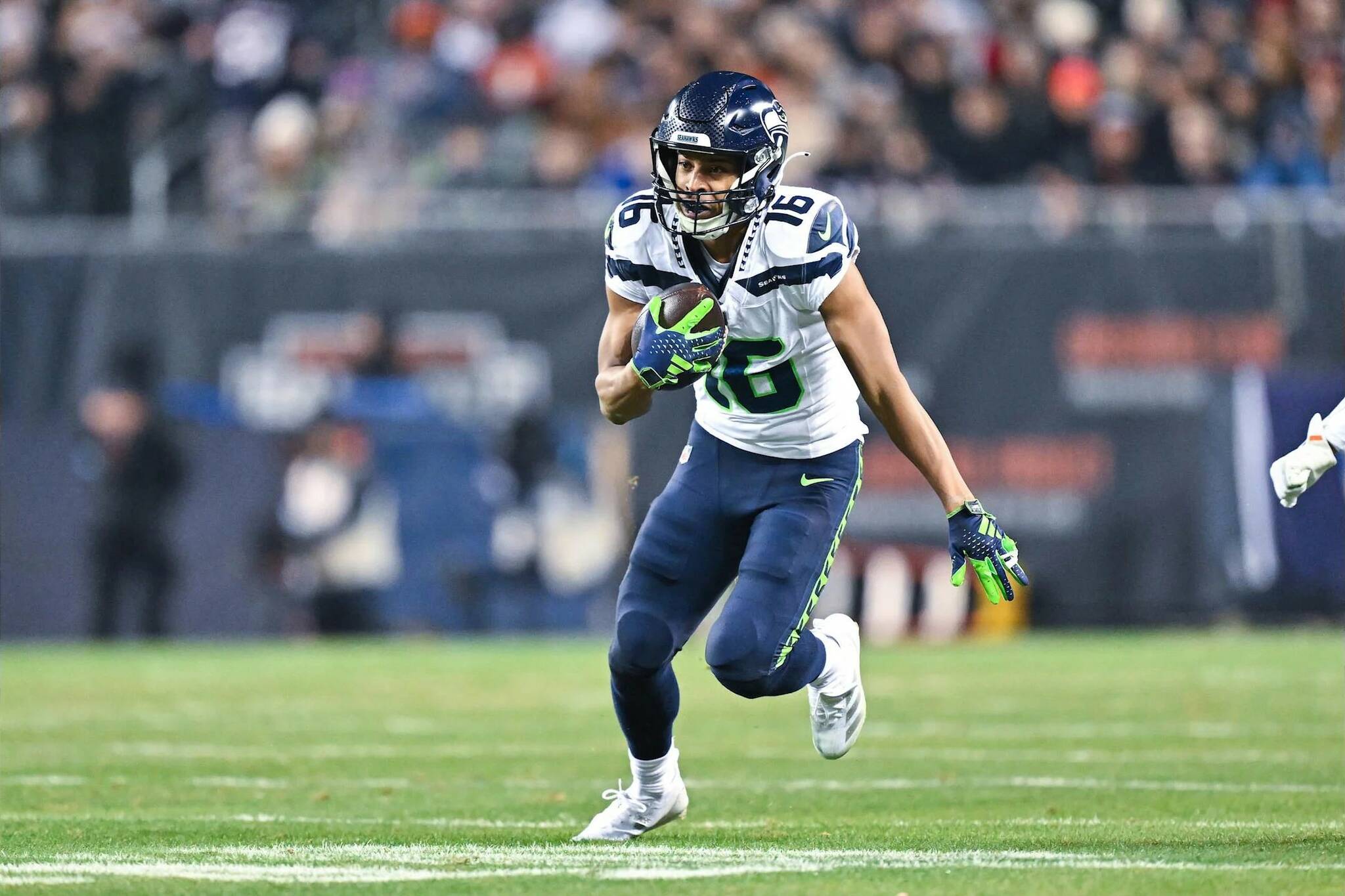 Seahawks receiver Tyler Lockett (16) runs with after a catch against the Chicago Bears at Soldier Field on Thursday, Dec. 26, 2024. (Photo courtesy of the Seattle Seahawks)