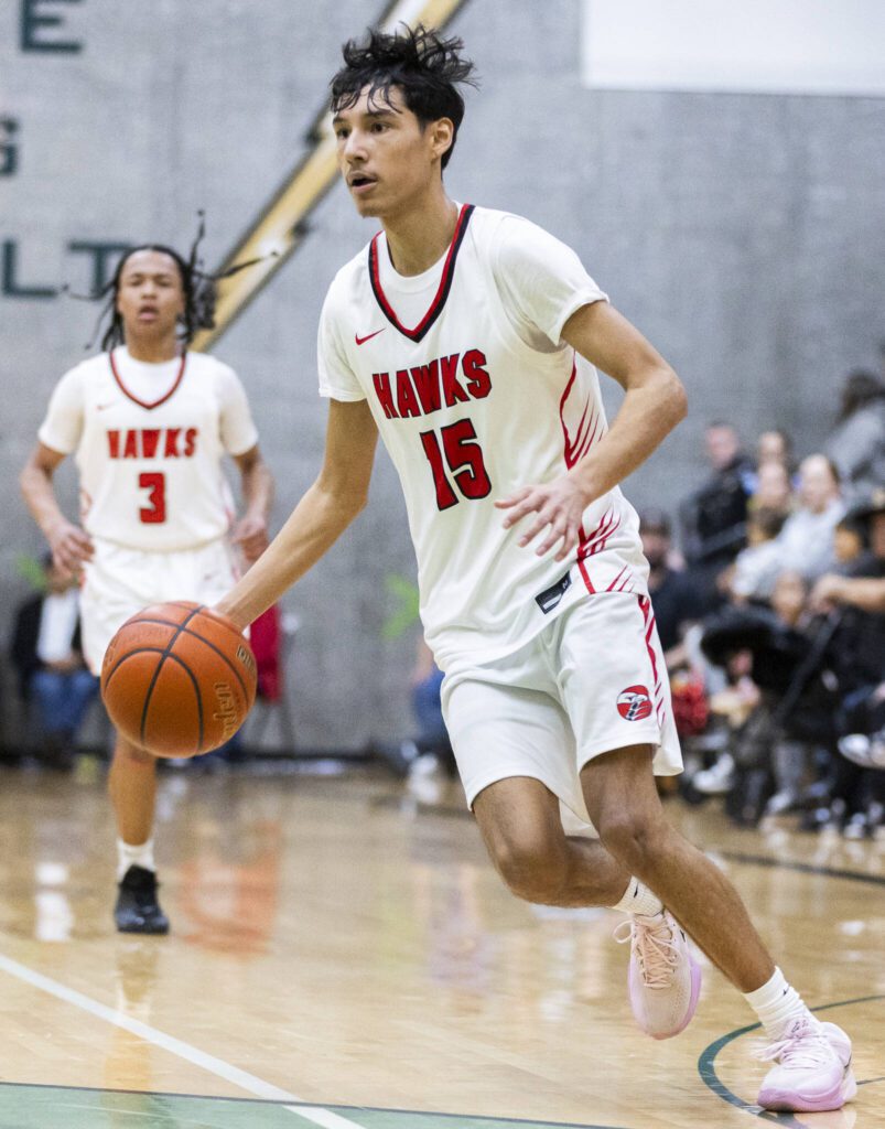 Tulalip Heritage’s Tokala Black Tomahawk dribbles the ball down the court during the winner-to-state playoff game against Muckleshoot Tribal School on Tuesday, Feb. 18, 2025 in Marysville, Washington. (Olivia Vanni / The Herald)
