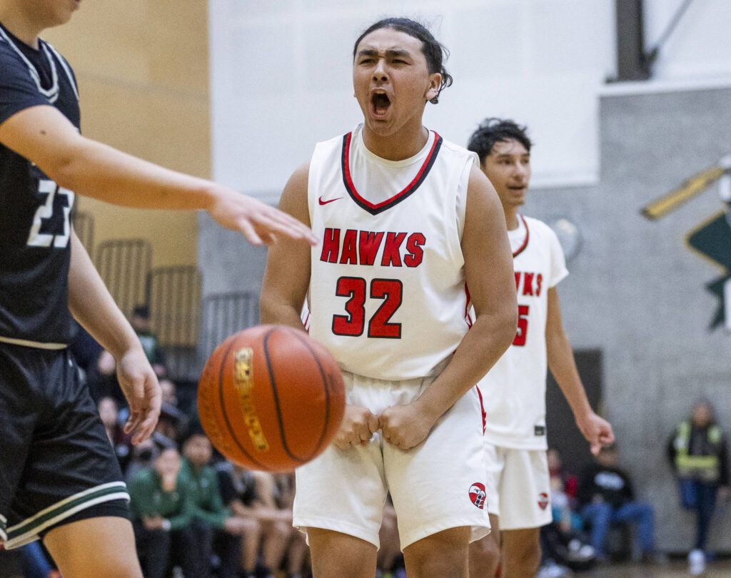 Tulalip Heritage’s Peyton Hatch reacts to drawing a foul after making a layup during the winner-to-state playoff game against Muckleshoot Tribal School on Tuesday, Feb. 18, 2025 in Marysville, Washington. (Olivia Vanni / The Herald)
