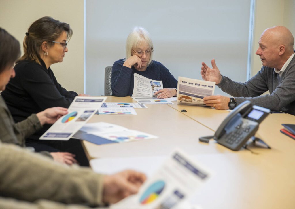 U.S. Sen. Patty Murray listens as Compass Health CEO Tom Sebastian talks about their current projects Friday in Everett. (Olivia Vanni / The Herald)
