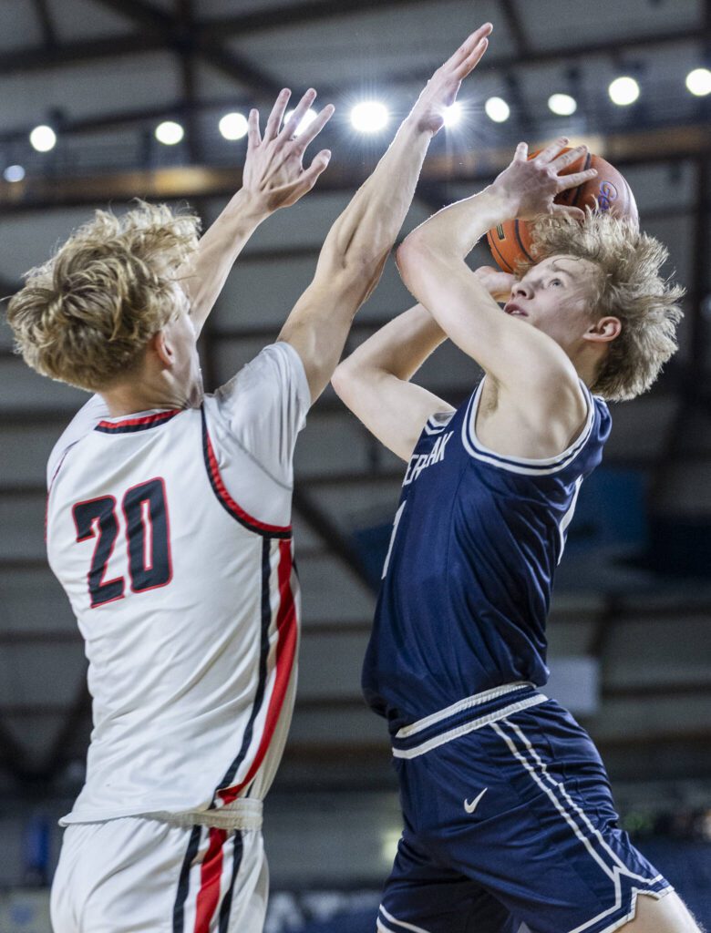 Glacier Peak’s Reed Nagel makes a layup while being guarded during the 4A boys quarterfinal game against Camas on Thursday, March 6, 2025 in Tacoma, Washington. (Olivia Vanni / The Herald)
