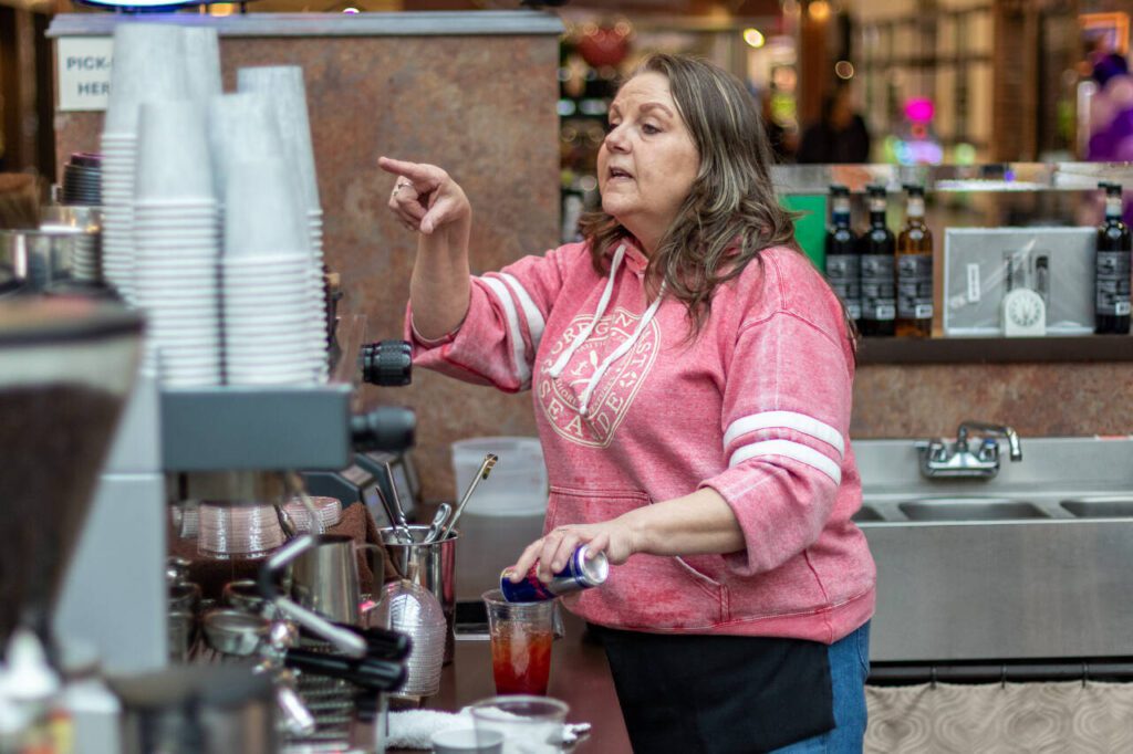 Mall kiosk owner Maureen McMahill takes drink orders Thursday, March 20, 2025, in the Everett Mall in Everett, Washington. (Aaron Kennedy / The Herald)
