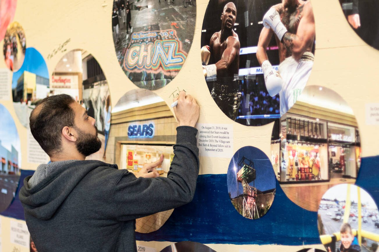 Employees and patrons of the Everett Mall signed a timeline mural that traces the history of the 51-year-old indoor mall that was once considered the premier place to go shopping in the city. Thursday, March 20, 2025 (Aaron Kennedy / The Herald)